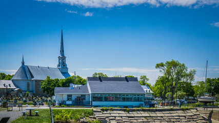 View on St Michel de Bellechasse's church from the pier in the small port of this cute little town of Quebec (Canada)