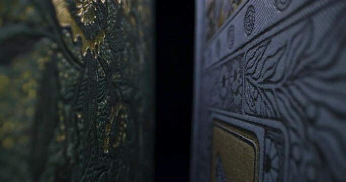 Macro slider shot through vintage book covers in 4K against black background