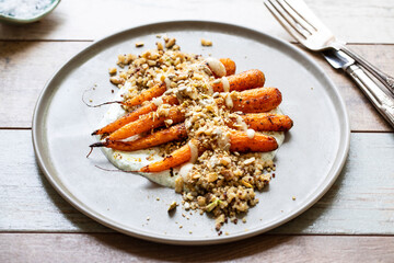 Cumin spiced roast carrots with dukkah, quinoa and garlic sauce