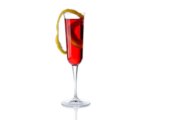 Red cocktail with lemon zest in trumpet glass isolated on white, copy space