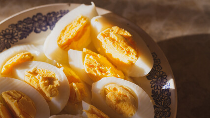 Boiled chicken eggs sliced on a plate