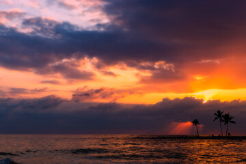 Sunset over ocean. Dramatic sky.