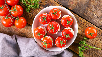 cherry tomato garnished with cream cheese