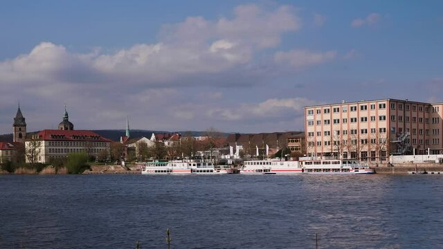 HAMELN, GERMANY - Apr 20, 2021: A boat that has docked in hameln on the weser on the other side of the river