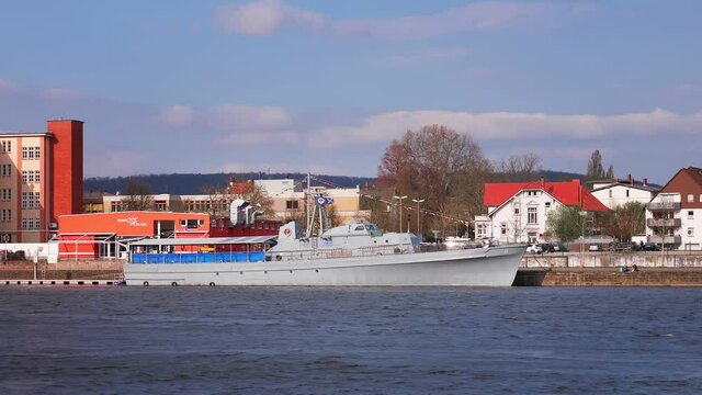 HAMELN, GERMANY - Apr 20, 2021: A boat that has docked in hameln on the weser on the other side of the river