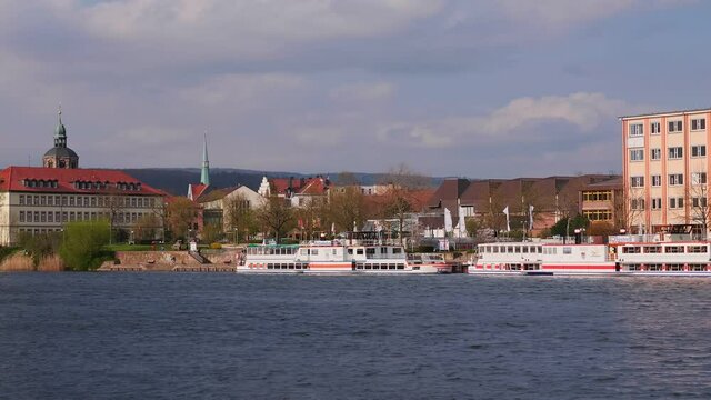 HAMELN, GERMANY - Apr 20, 2021: A boat that has docked in hameln on the weser on the other side of the river