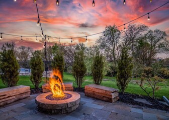 Luxury home during twilight golden hour with pink and purple sky and lush landscaping in Nebraska USA