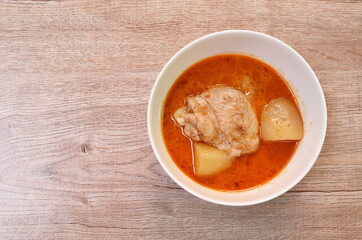 chicken curry with slice potato and onion in bowl
