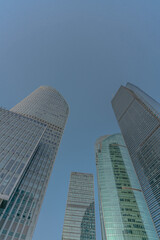 Obraz premium Low angle view of modern skyscraper with blue sky in Shanghai, China.