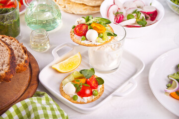Round crispbread toast with greens and vegetables. Healthy food concept.