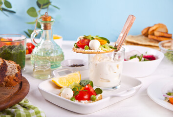 Round crispbread toasts with greens and vegetables. Healthy food concept.