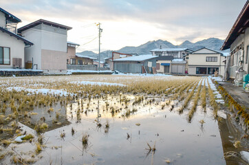 Landscape view of the small village among the snow valley in winter time 