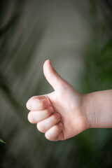 hand showing thumb up