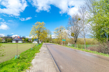 Fototapeta premium Entrance road to Trabki Wielkie village in Poland.