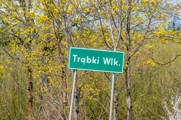 Entrance Trabki Wielkie street sign to village Kaczki in Poland.