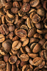 Brown roasted coffee beans. Closeup shot of coffee beans.