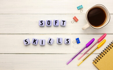 Cubes with the abbreviation SOFT SLILLS, coffee and office supplies