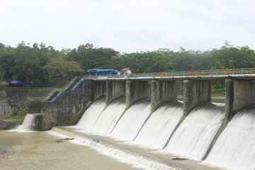 river water flows in the ancient water dam for rice fields irrigation and community irrigation. this building is a cultural heritage building. 