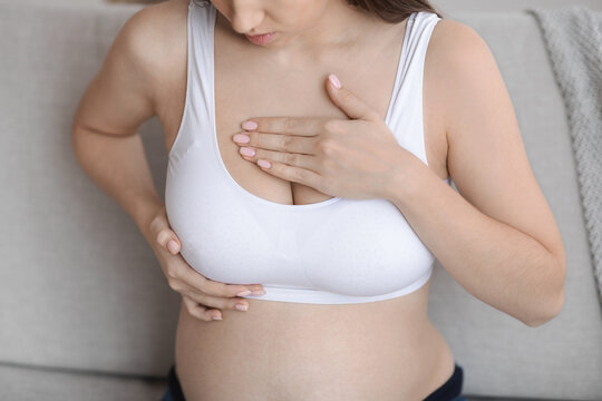 Fibrocystic Breast Disease. Closeup Shot Of Pregnant Woman Massaging Chest Area
