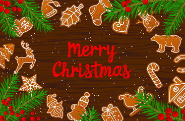 Merry Christmas and Happy New Year seasonal winter card background  gingerbread cookies on wooden texture table framed by xmas pine tree branches and red berries