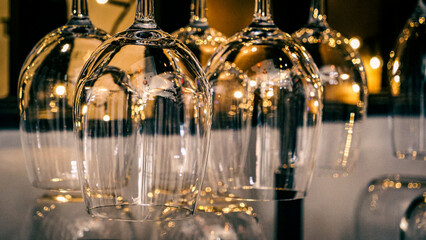 Wine glasses hung upside down.