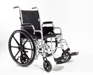 Fototapeta na wymiar An adult size Wheelchair in black isolated on white