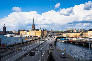 Fototapeta na wymiar Panoramic view of the center of Stockholm. The metro train moving the Slussen district. Amazing view of the Sodermalm island, The City Hall, Riddarholmen in Gamla Stan.