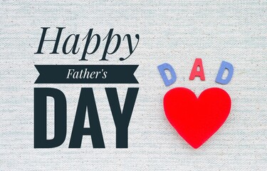 Happy father's day logo with Red heart and Dad wooden text on canvas fabric background