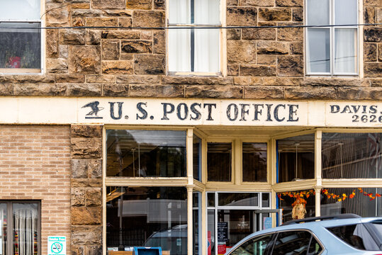 Davis, USA - October 5, 2020: West Virginia small vintage town downtown near Blackwater Falls State park with retro sign for USPS United States Post Office