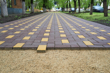 laying paving slabs in a city street, pavement tile closeup