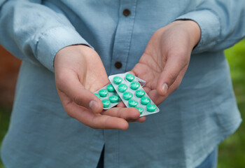 Man holding pills. Concept of medicine.