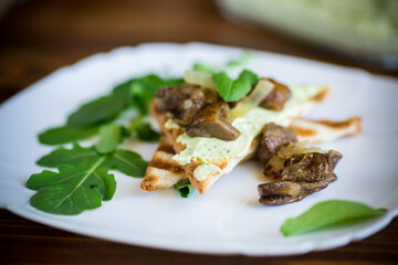fried toast with cheese spread, arugula and fried mushrooms