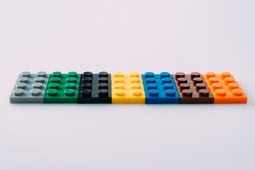 Plastic building blocks on white background