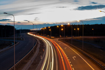 Obraz na płótnie Canvas lights of moving cars at night. long exposure