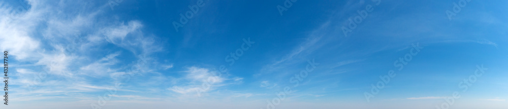 Wall mural blue sky background with tiny clouds. panorama background