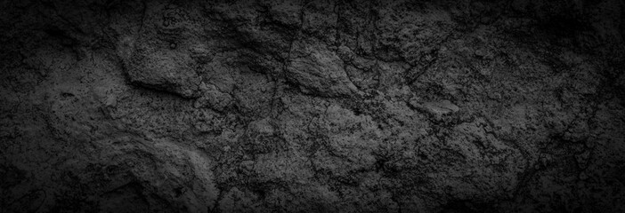 Fototapeta na wymiar black limestone rock with visible details. background or texture