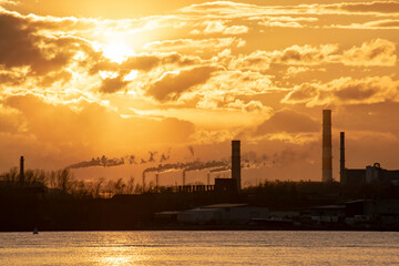 Industry in a city by the river. Ecological concept.