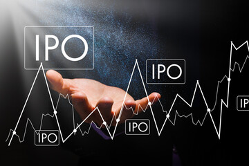 Businessman hand touching IPO or Initial Public Offering sign on virtual screen.