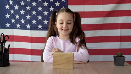 Pupil girl talks about American Flag Day on June 14th. Distance lesson and education remotely. Online teacher or tutor via video link. Holidays of America.