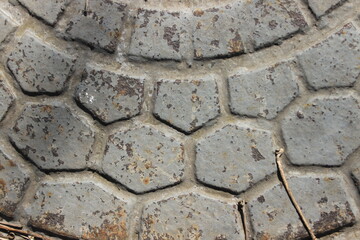 Patterns on the surface of the iron cover. Russia.