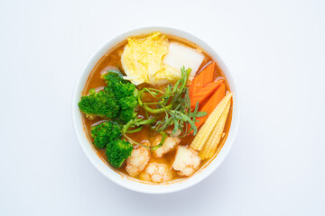 Mixed Vegetable in Sour soup made of Tamarind Paste with Shrimps and Vegetable Omelet - Asian food style or Thai food style isolated on white background