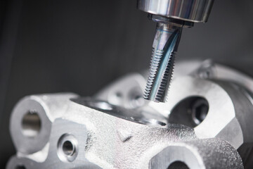 cnc machine at work. cutting tool processing steel metal detail on turning cnc lathe machine in...