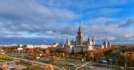 Fototapeta na wymiar Aerial panoramic view of sunset campus buildings of famous Moscow university under dramatic cloudy sky in autumn