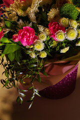 Flowers in a bouquet in an evening cafe