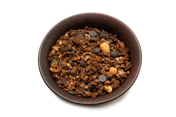 Chocolate granola cereal with nuts in a bowl background.