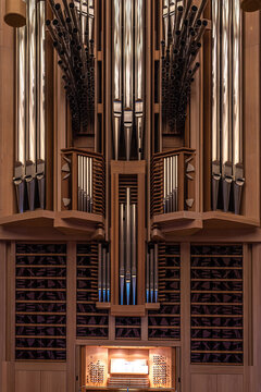Fragment of big organ at the Moscow House of Music, register with different pipes from metal, musical instrument, selected focus, vertical photo