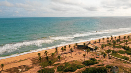 Aerial shot of the shore by the Atlantic Ocean captured in Badagry, Lagos State, Nigeria - obrazy, fototapety, plakaty