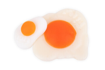 Pop art background. A lot of marmalade fried eggs on purple pastel background. Minimalism food still life