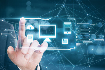 Hand touching a hologram desktop with different icons in it. Big data and technology concept