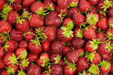 Strawberry red berries background top view